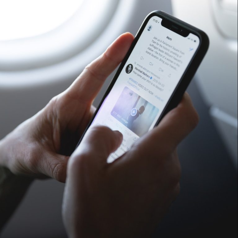 person holding space gray iPhone X
